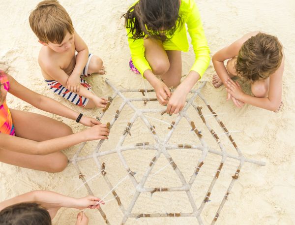 A Group Of Children Playing With Sand
