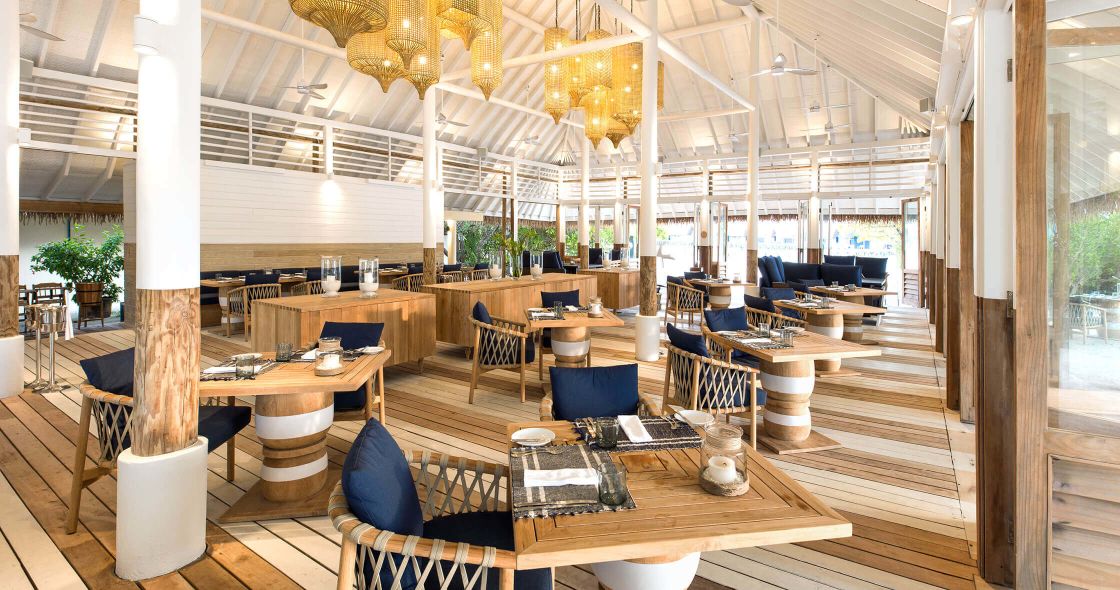 A Room With Tables And Chairs