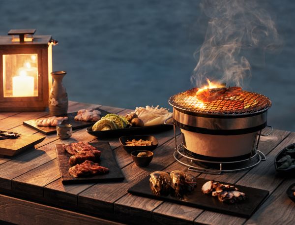 A Table With Food And A Fire