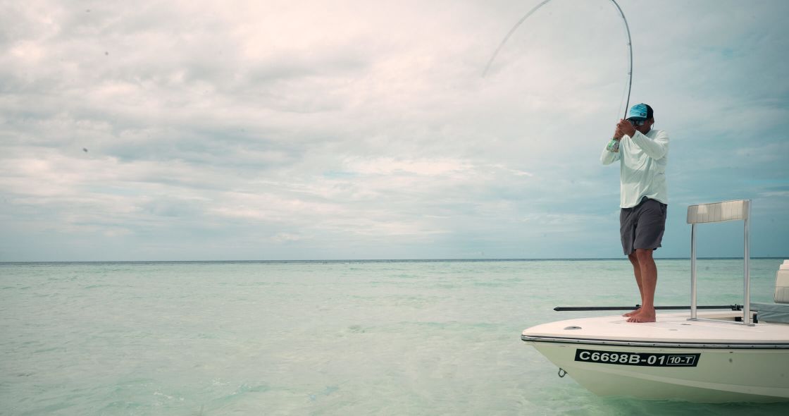 A Man Fishing On A Boat