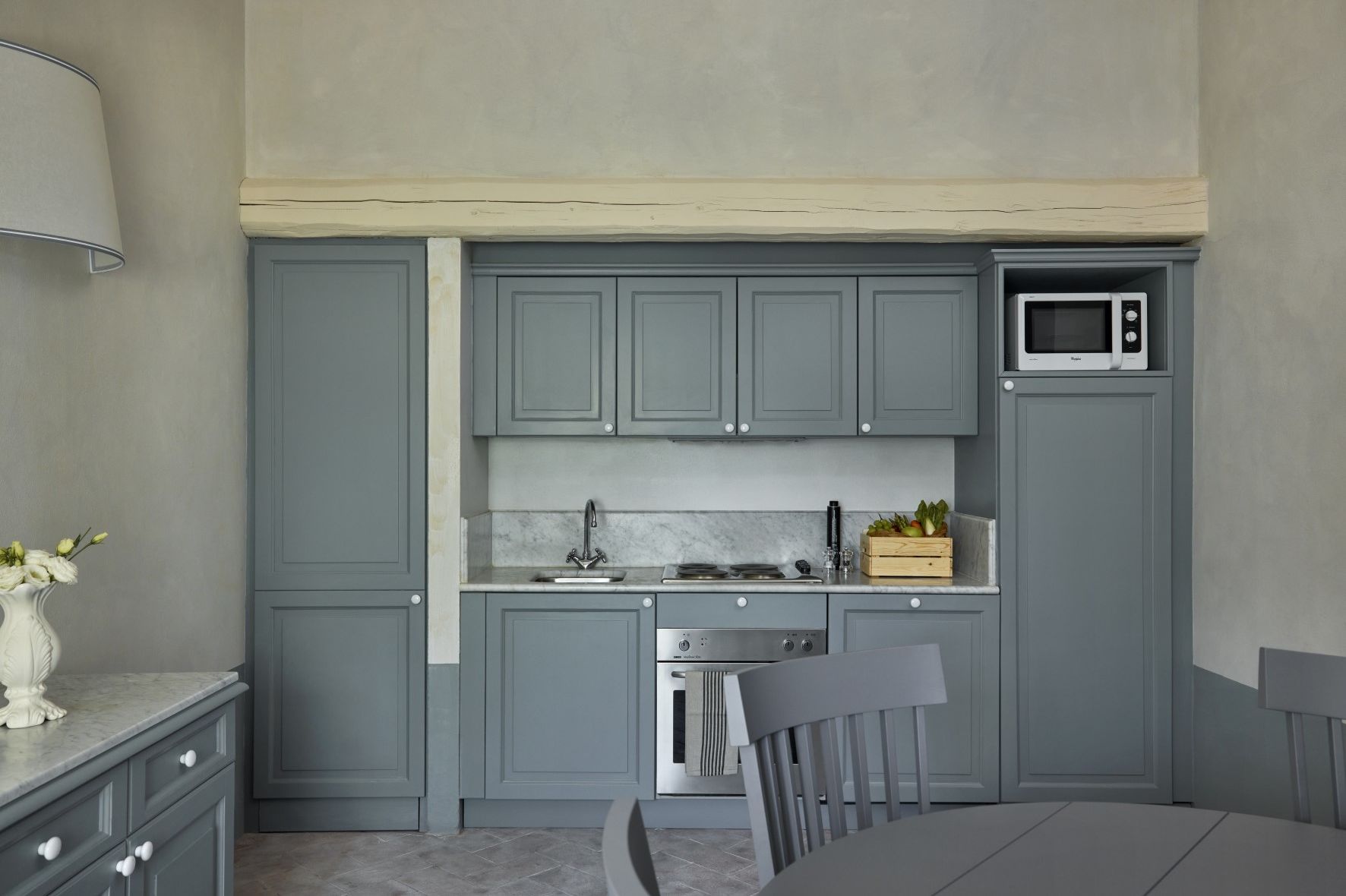 A Kitchen With White Cabinets