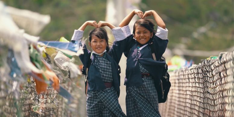 A Couple Of Girls Carrying Baskets