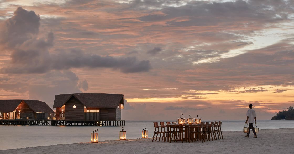 A Person Walking On A Beach