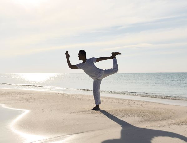 A Man Standing On A Beach