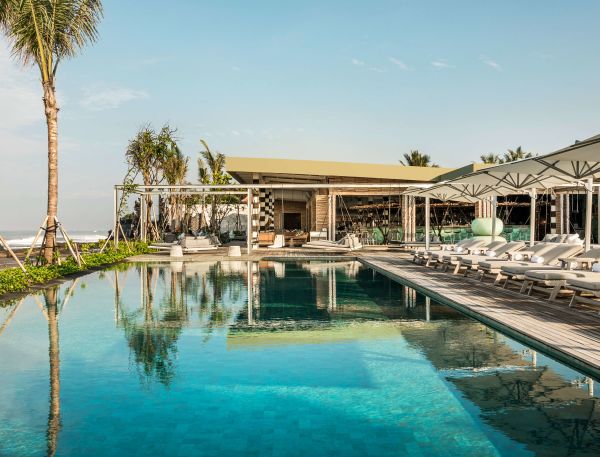 A Swimming Pool With A Building In The Background