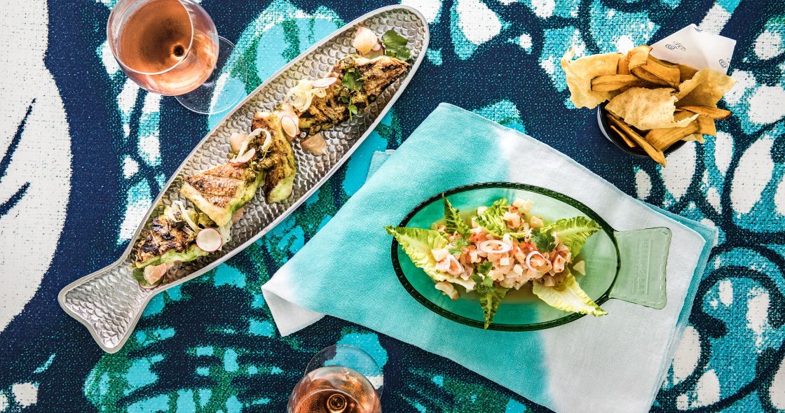 A Plate Of Food And A Glass Of Beer On A Table