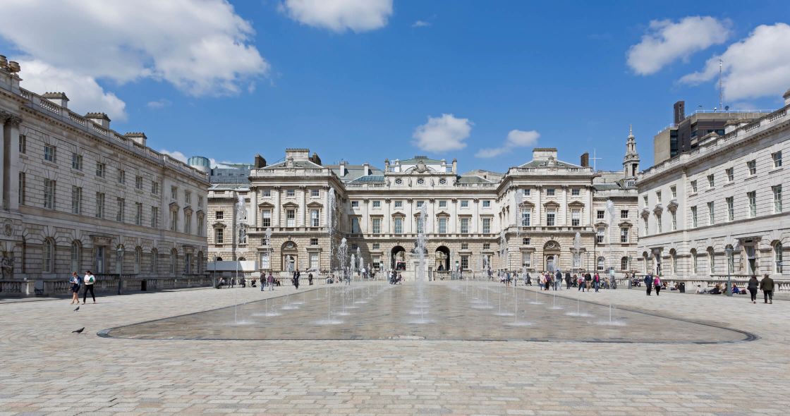 A Large Stone Building With Many Windows
