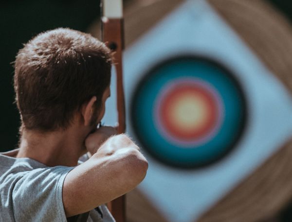 A Man Holding A Large Circle