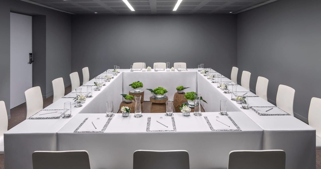 A Table With Chairs And Glasses On It