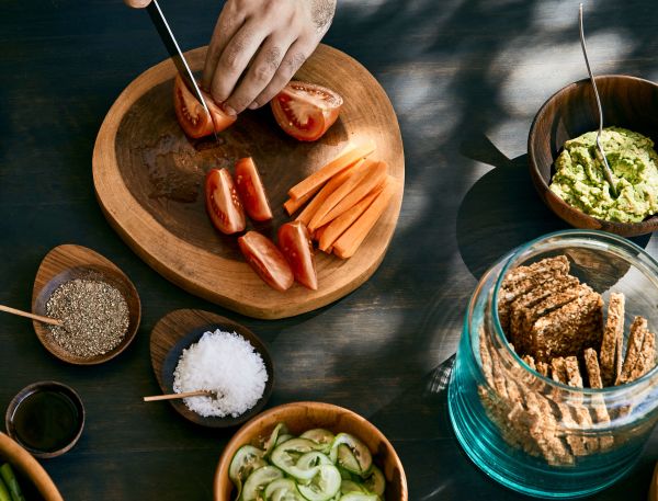A Person Cutting A Fruit