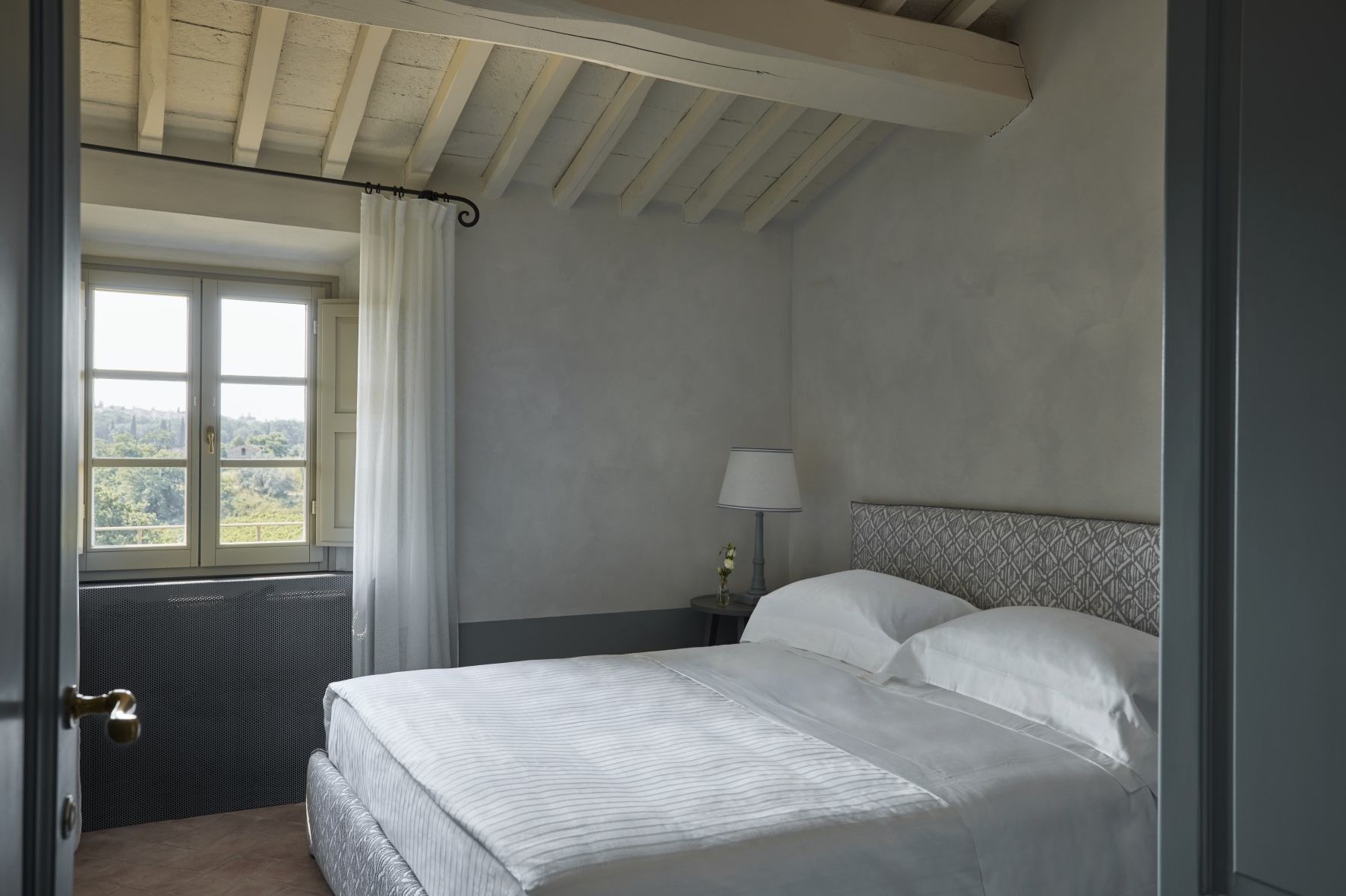 A Bed With White Sheets