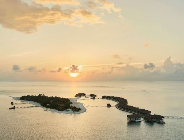 A Beach With Islands And Boats