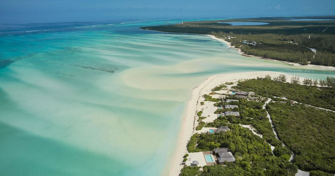 A Beach With Houses And Trees