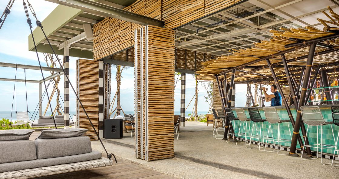 A Person Standing In A Room With A Large Metal Structure