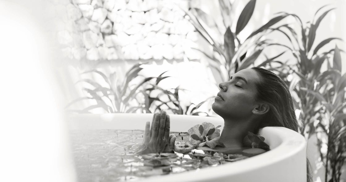 A Woman Lying In A Bathtub