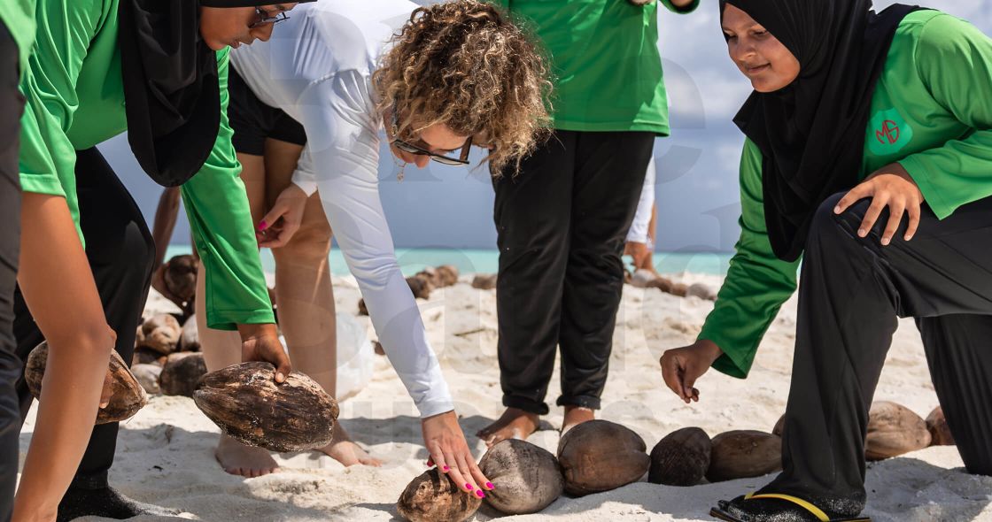 A Group Of People Working On A Fire