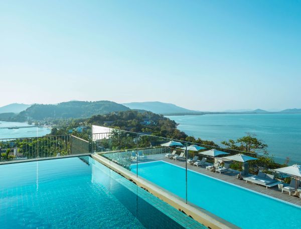 A Pool With A Building In The Background