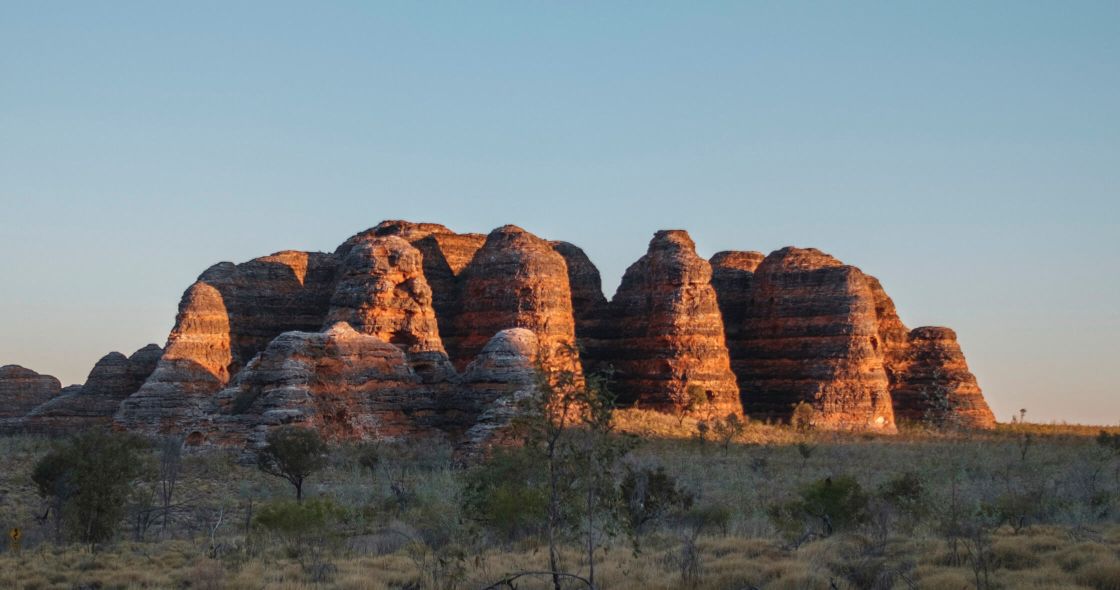 A Large Rock Formation With Cathedral Rock In The Background