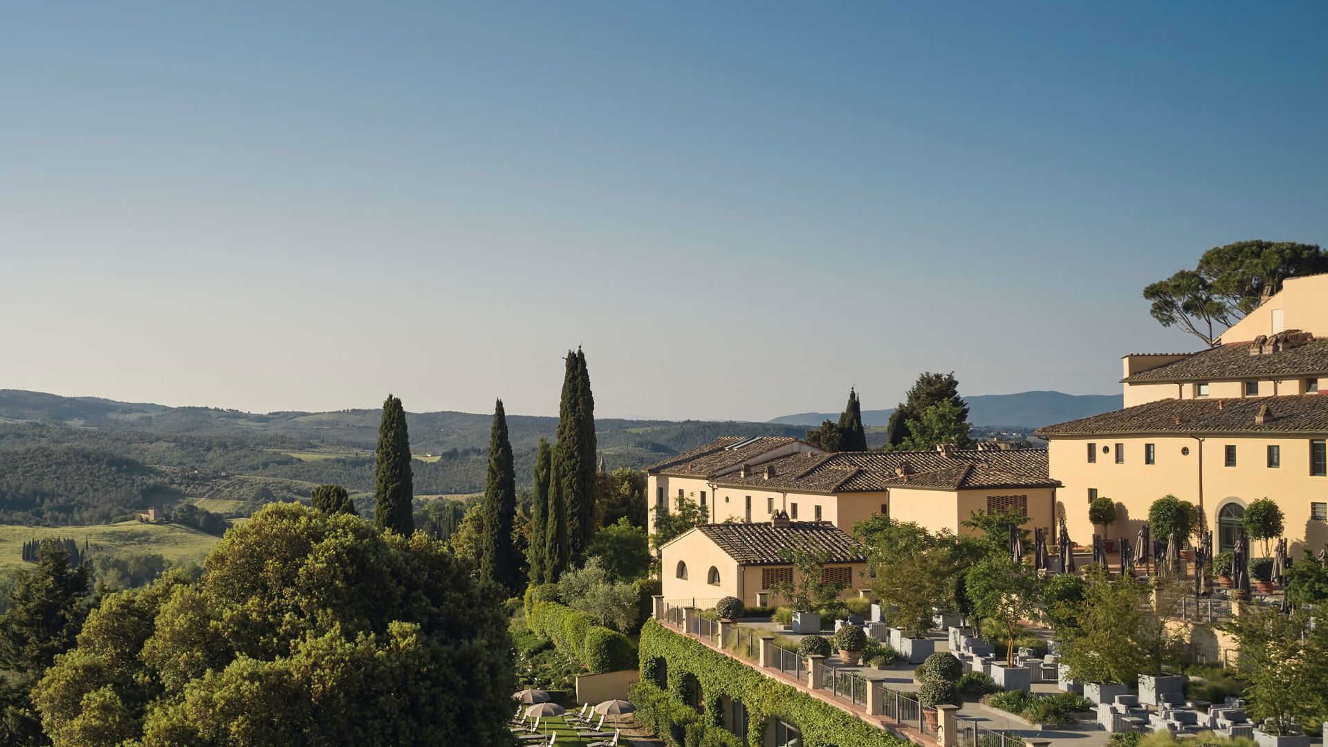 A Pool Surrounded By Trees And Buildings