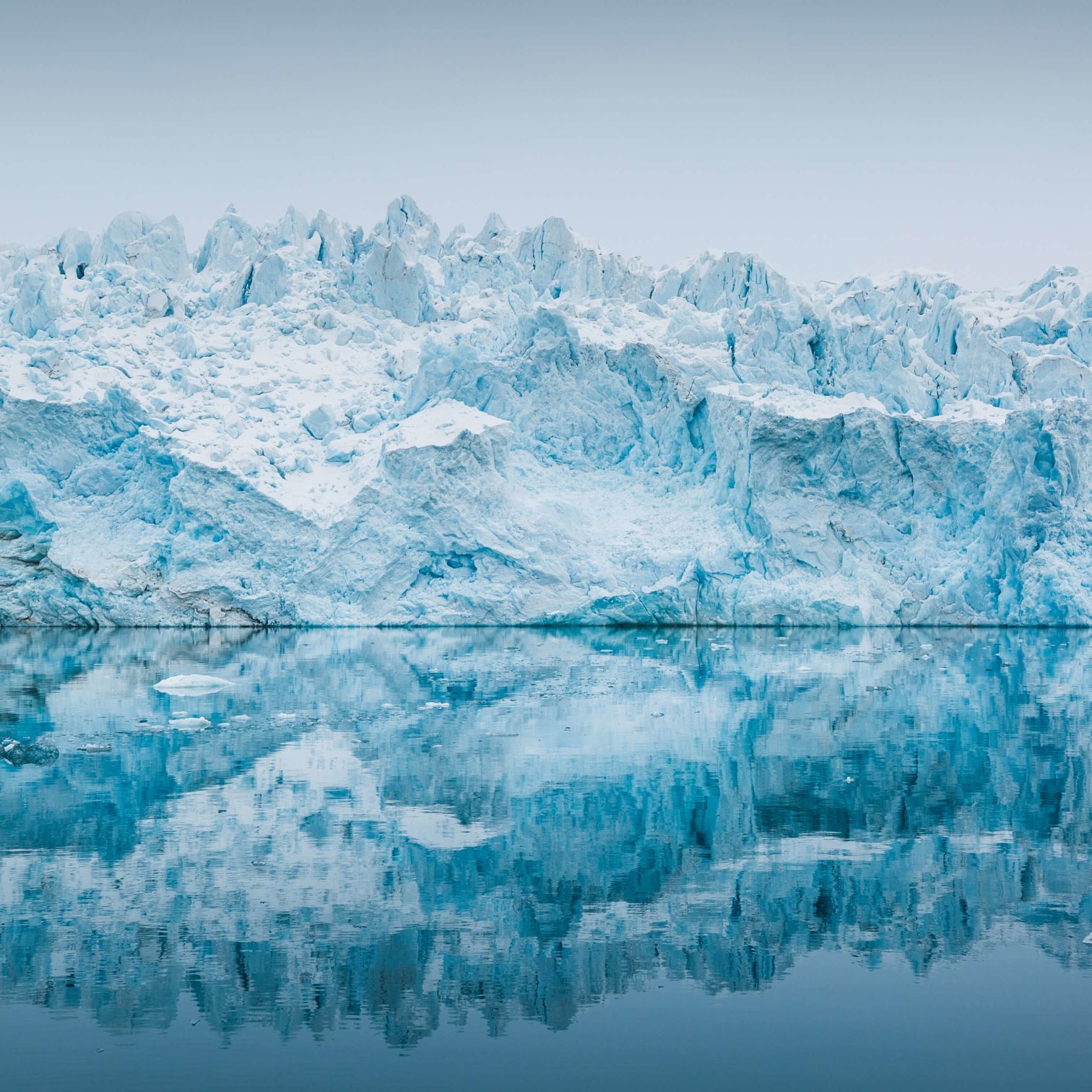A Snowy Mountain With A Fence