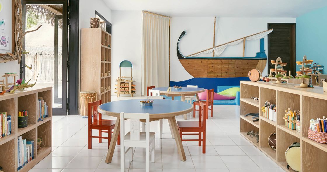 A Room With A Table And Chairs